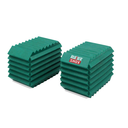 Two stacks of green rubber shox on a white background